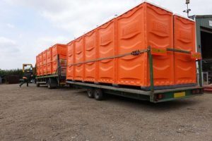 7.5tonne HGV transporting portable toilets with trailer