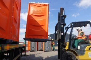 unloading plant hire, portable toilets with forklift